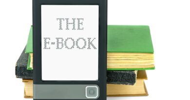 Modern ebook reader and old paper books